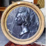 A LATE 19TH CENTURY CIRCULAR PLASTER RELIEF PORTRAIT with a black marbled paint effect and mounted