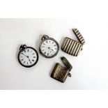 TWO SILVER CASED POCKET WATCHES with white enamel dials, a Birmingham silver engraved vesta case and