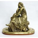 A 19TH CENTURY LACQUERED BRONZE SCULPTURE of a lady in classical dress seated on a stool, after
