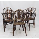 TWO SIMILAR ASH AND ELM WINDSOR ARMCHAIRS with wheel back splats, carved saddle seats and turned