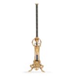 A GILT, BRONZE AND GREEN PAINTED FIGURAL LAMP STANDARD standing on three cloven feet 144cm high