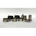 A LONDON SILVER CONDIMENT SET two napkin rings, two EPBM salt cellars and one other Birmingham