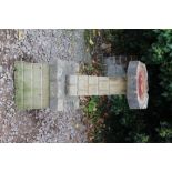 A LATE 20TH CENTURY RECONSTITUTED STONE BIRD BATH with rusticated block work decoration 36cm wide