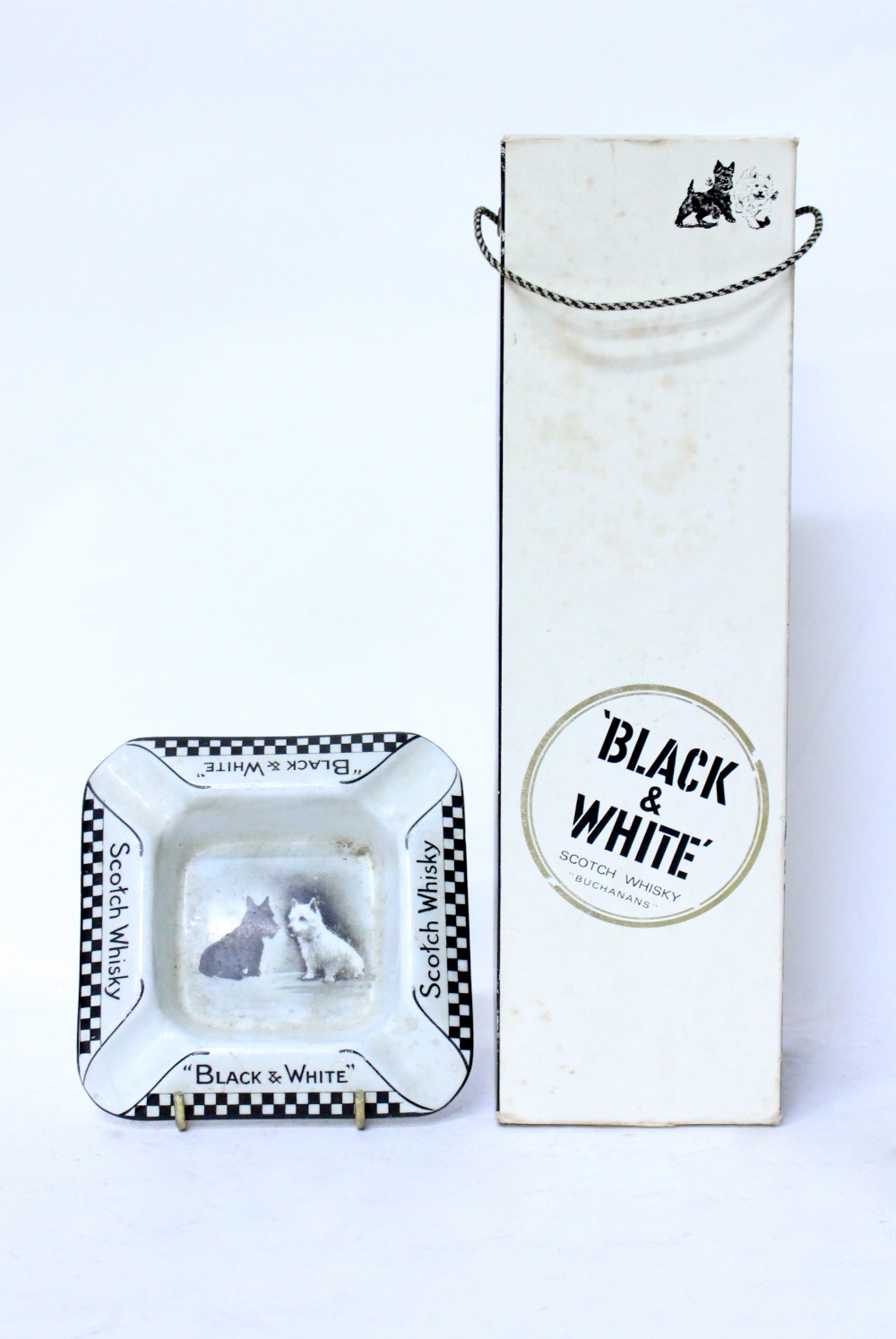 A BOTTLE OF BUCHANAN'S 'BLACK & WHITE' SCOTCH WHISKY together with an advertising ashtray for the