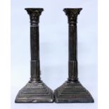 A PAIR OF SILVER CANDLESTICKS of Corinthian column form, each 30cm in height (2)