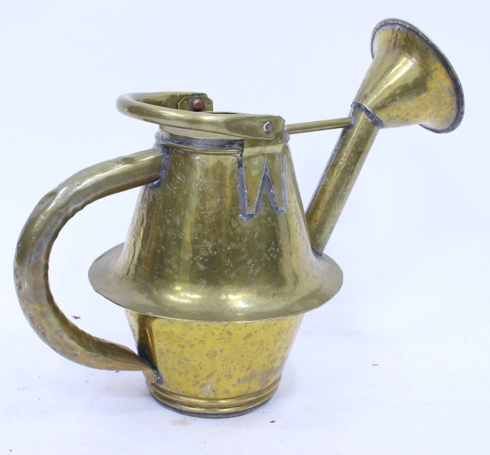 AN ANTIQUE FRENCH BRASS WATERING CAN with hinged loop handle, 47cm high