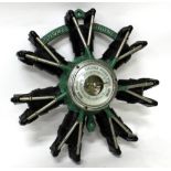 A FRENCH CAST AND PAINTED ALUMINIUM WALL HANGING ANEROID BAROMETER in the form of a rotary Aero
