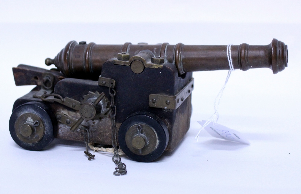 A HAND MADE DESK TOP MODEL of a canon approximately 21cm long overall