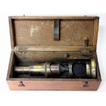 A MAHOGANY CASED FIELD MICROSCOPE (unmarked), 19cm high