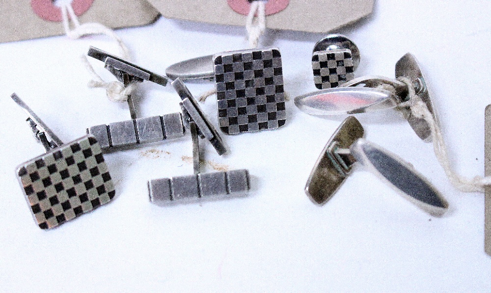 A PAIR OF GEORG JENSEN WHITE METAL CUFFLINKS with a checkerboard design, designed by Flemming