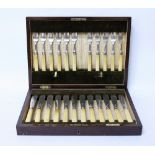 A WALKER & HALL 23 PIECE SILVER CANTEEN of fish knives and forks, each with ivory handles and