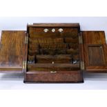 A VICTORIAN BURR WALNUT VENEERED SLOPING FRONTED CORRESPONDENCE BOX the hinged front opening to