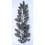 A LATE 19TH / EARLY 20TH CENTURY WHITE METAL WREATH or sprig of oak leaves and berries, marked F.G.