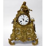 A 19TH CENTURY FRENCH F.L.HAUSEBURG GILT METAL MANTLE CLOCK with white enamel dial and black Roman