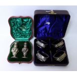 A PAIR OF EDWARDIAN SILVER PEPPERETTES by the Alexander Clark Co., each with marks for Birmingham