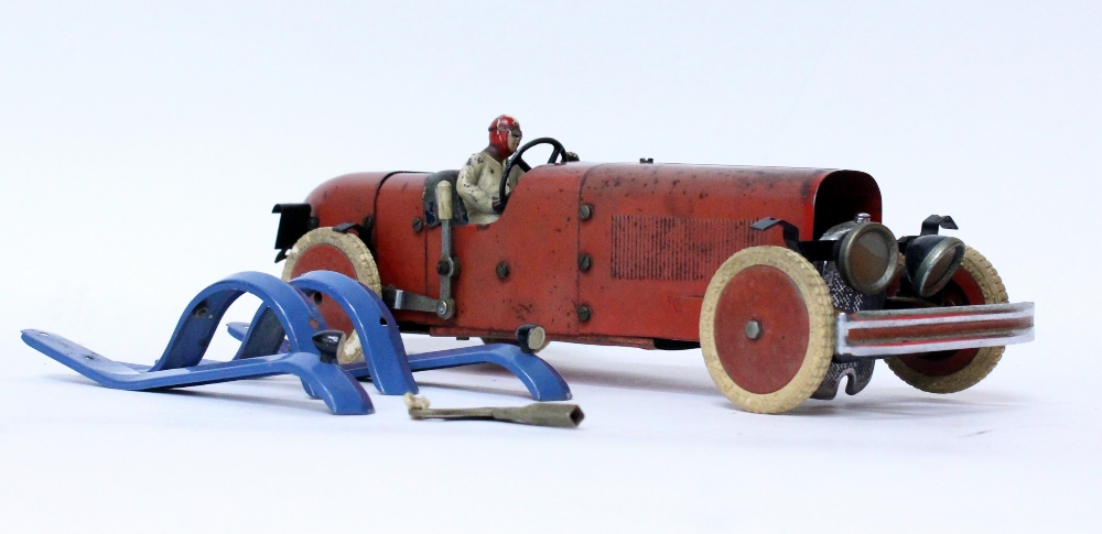 A 1930'S / 40'S MECCANO TIN PLATE CLOCKWORK RACING CAR with a red body ...
