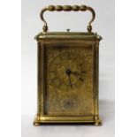 A LATE 19TH CENTURY FRENCH GILT CASED REPEATER CARRIAGE CLOCK with engraved front plate and alarm