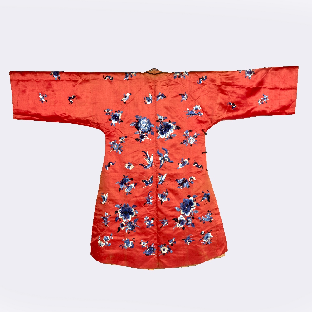 A Chinese red ground embroidered robe 19th Century with blue flower and butterfly designs - Image 2 of 2