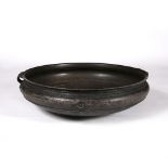 A South East Asian large bronze vessel 18th/19th Century of ribbed form with two handles, 81cm