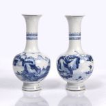 A Chinese blue and white bottle vase 18th/19th Century with a single panel of boatmen and figures in