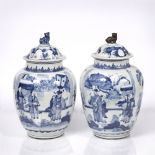 A pair of Chinese blue and white ovoid jars and covers 19th Century decorated in the Kangxi manner