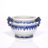 A Chinese blue and white porcelain bronze style two handled ding decorated squat globular body