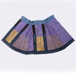 A Chinese purple and gold silk skirt 19th Century with blue embroidered floral border