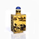 A Chinese porcelain snuff bottle 19th Century of rectangular form, underglaze yellow ground and