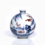 A Chinese porcelain globular snuff bottle decorated in underglaze blue and red depicting oxen and