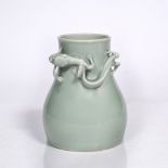 A Chinese porcelain pear-shaped vase 19th Century decorated with a pale green monochrome glaze,