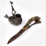 A South Indian Bichawa dagger with double edged steel blade, the brass handle decorated with figures