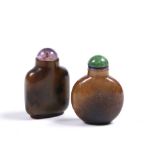 A Chinese chalcedony snuff bottle 1800-1850 of square flattened oviform, the stone of dark brown