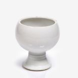 A Chinese globular stem cup 19th Century decorated with an allover white glaze engraved with