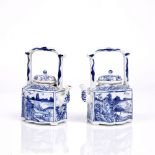 A pair of Chinese small blue and white porcelain teapots Kangxi (1662-1722) each having a panel of