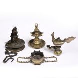 A collection of Indian bronze lamps including an oil lamp in the form of a bird, and three hanging