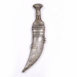 A Yemeni Jambiya dagger with horn handle and silver metal scabbard