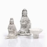 A Chinese Fukien blanc de chine seated figure of Guanyin 18th Century holding a scroll, 18cm, a