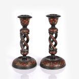 A pair of Indian Kashmiri candlesticks 19th Century columns of spiral form painted with flower