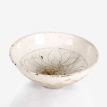 A Chinese ding ware deep bowl Song dynasty interior engraved with a lotus flower and foliage