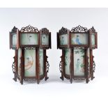 A pair of Chinese lanterns circa 1920 of hexagonal form with painted glass panels, 34cm high