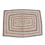 A Cantha textile cloth probably Indian, with alternating red and black thread rectangles on a