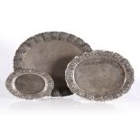 A set of three Indian silver metal graduated oval trays circa 1900 each with a wavy and embossed