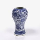 A Chinese blue and white baluster vase 19th Century with Indian lotus and trailing foliage, 22cm