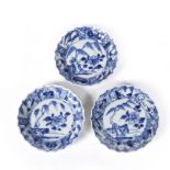 A set of three Chinese blue and white porcelain saucer dishes Kangxi (1662-1722) decorated with pine
