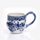 A Chinese blue and white porcelain cup Qianlong with entwined handle of moulded form with flower