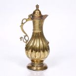 A brass Bukhara ewer 19th century, detailed with copper and engraved patterns, 30cm high