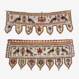 A pair of Indian beadwork courtiers each with stylised bird, animal and tree designs, 117cm