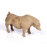 A Chinese pottery pig Han dynasty 206 BC - 220 AD the standing animal with head slightly tilted