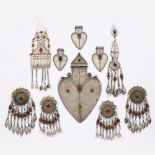 A collection of Tekke Turkoman carnelian set jewellery to include a large hart shaped pendant and