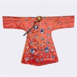 A Chinese red ground embroidered robe 19th Century with blue flower and butterfly designs